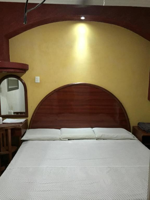 Guest room with a king bed at Hotel Xalapa in Veracruz, Mexico
